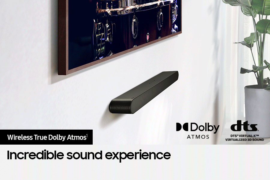 Samsung Soundbar connected wirelessly to TV. Dolby Atmos logo and DTS Virtual:X logo.