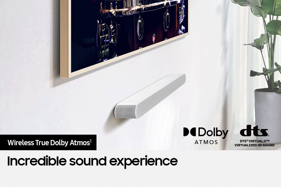 Samsung Soundbar connected wirelessly to TV. Dolby Atmos logo and DTS Virtual:X logo.