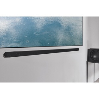 Samsung TV with the ultra slim soundbar is hanging on the living room.  *Cable not shown.