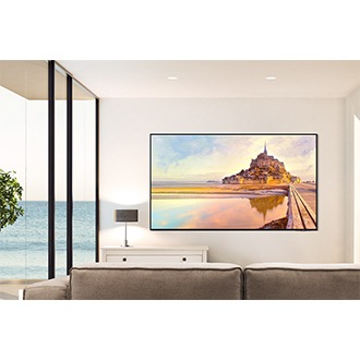 QN90D is wall-mounted in a clean white living room.