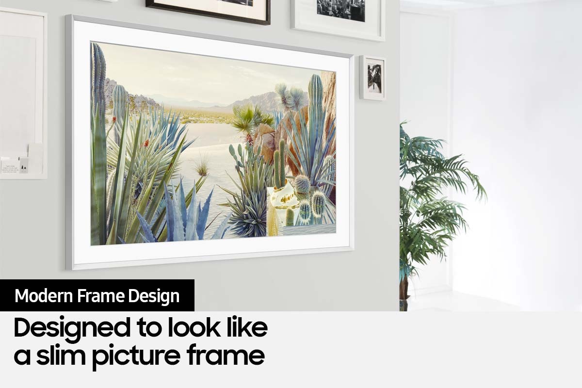 The Frame TV is mounted on the wall of a home interior and its modern frame design blends with the other picture frames on the wall.
