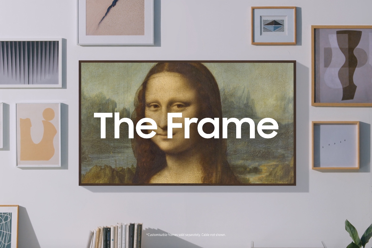 A wall with various picture frames and then Samsung’s The Frame TV blending seamlessly and displaying Mona Lisa art in Art Mode.