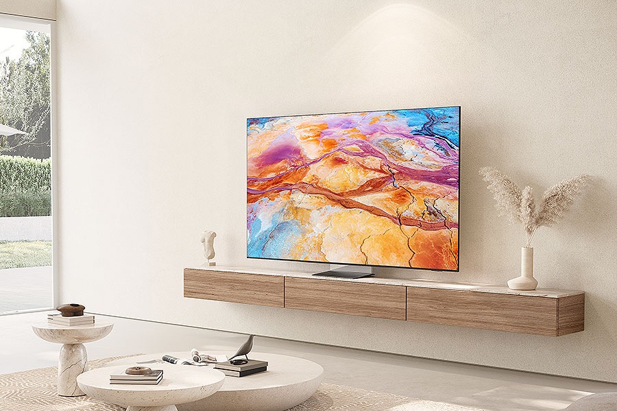 QN900D sits elegantly on top of a console in a warm living room.