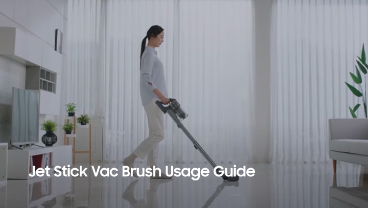 Lady vacuuming using Jet Stick Vac