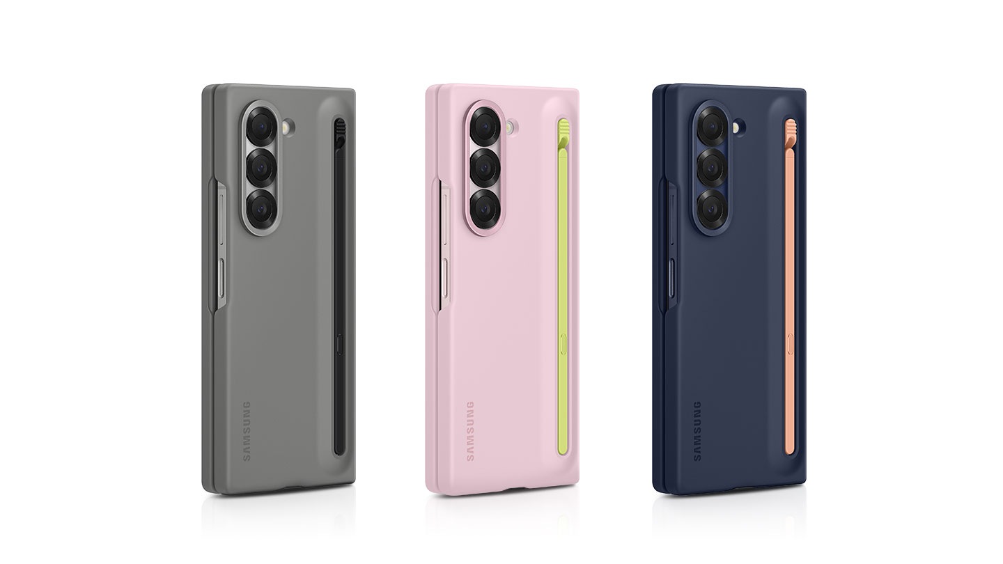 Three units of the fully-folded Galaxy Z Fold6 in S Pen Cases can be seen standing upright in a line-up. Each case is a different color. There's a gray-colored S Pen Case with black pen, a pink-colored one with lime pen, and a navy-colored one with pink pen. For all phones, the S Pen can be seen securely and conveniently nestled in the S Pen slot at the back of the case.