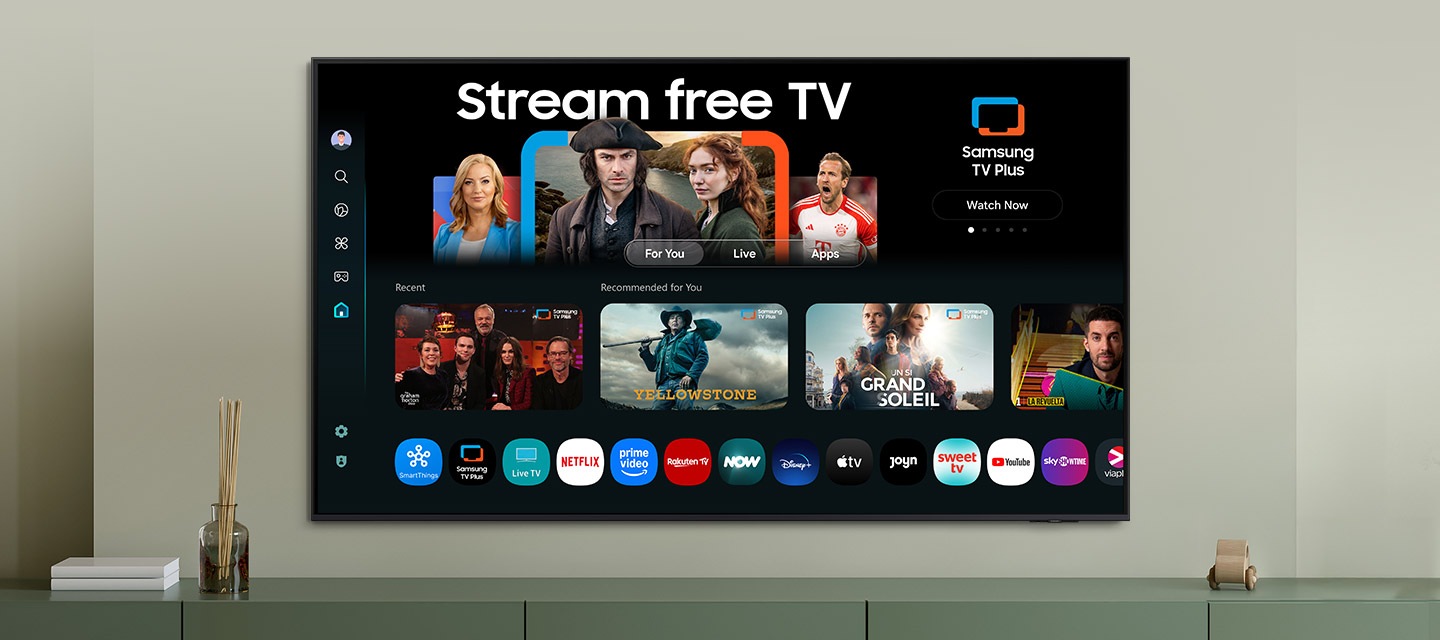 One UI Tizen’s home screen, with the various apps and services available, is displayed on a TV in a living room.
