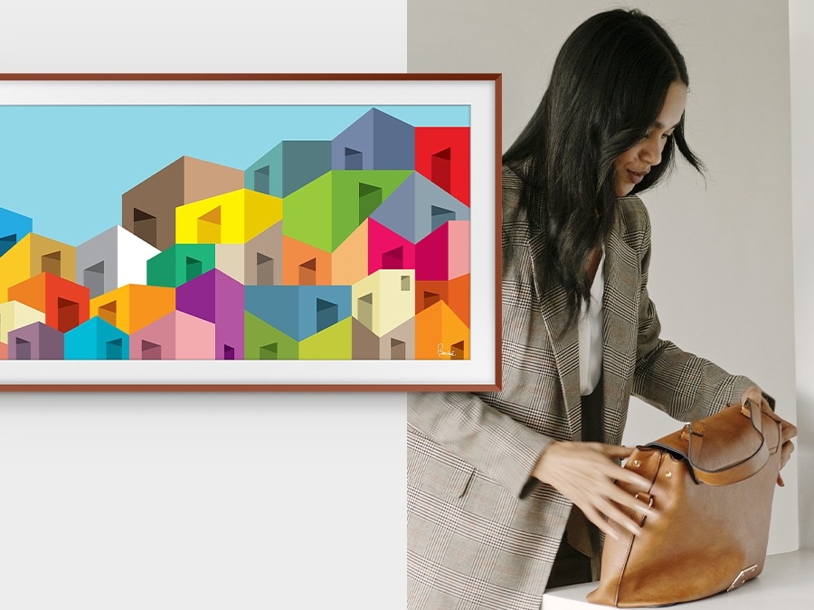 A woman packs her bag and leaves. The Frame, which was displaying an artwork, turns off once it sensed there was no one in the room.