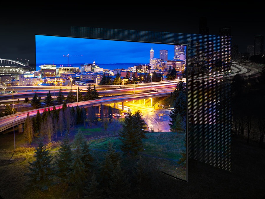 A city lit up by bright lights is on display. The colors and lights are vivid as OLED lights portray through the QD screen.