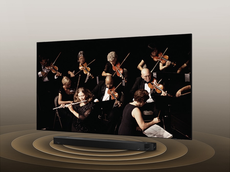 Simulated sound wave graphics from TV and soundbar demonstrate Q Symphony technology as they play sound together.