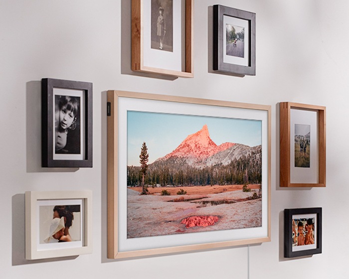 The Frame lifestyle tv on wall with picture frames