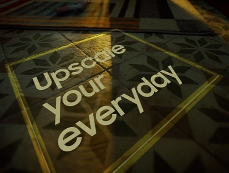 A floor that displays the words Upscale your everyday within a painted square.