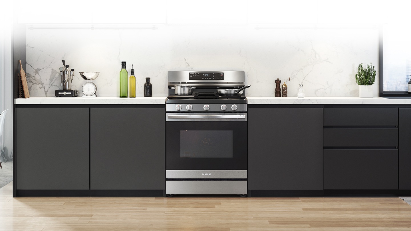 Shows a modern kitchen with the stylish, stainless steel oven fitting neatly into the design.