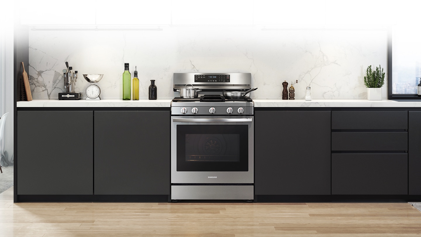 Shows a modern kitchen with the stylish, stainless steel oven fitting neatly into the design.