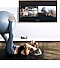 A woman is working out in front of her TV. On the TV screen she can see a screen of herself as well as the screen of the fitness trainer and below the TV her smartphone camera is capturing her workout so she can see it on the TV screen.