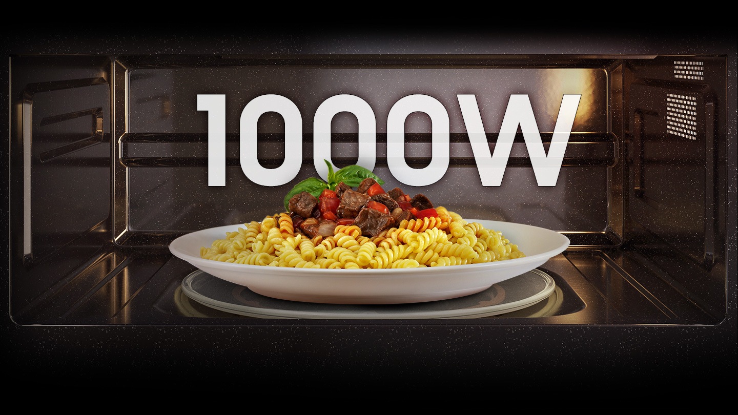 Shows a pasta dish being cooked inside the OTR with the output power of 100W highlighted in text above it.