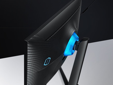 The back of the monitor is illuminated by a blue neon light that surrounds the connection point between the monitor and the base. The backside of the monitor shows a checkered and striped pattern and a blue Odyssey logo in matching blue.