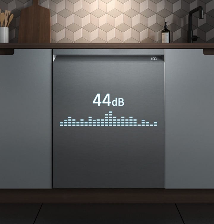 Shows a kitchen at night with a dishwasher working quietly, creating just 44 decibels.