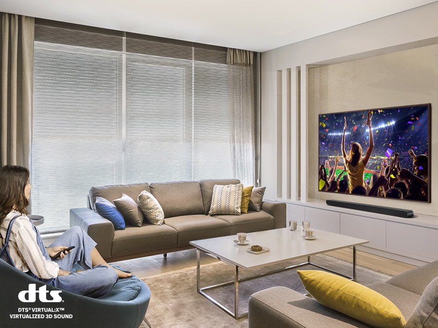 A woman enjoys a music concert on her TV. Simulated sound wave graphics illustrate the immersive 3D sound experience of Samsung S series soundbar. The dts virtual X logo can be seen.