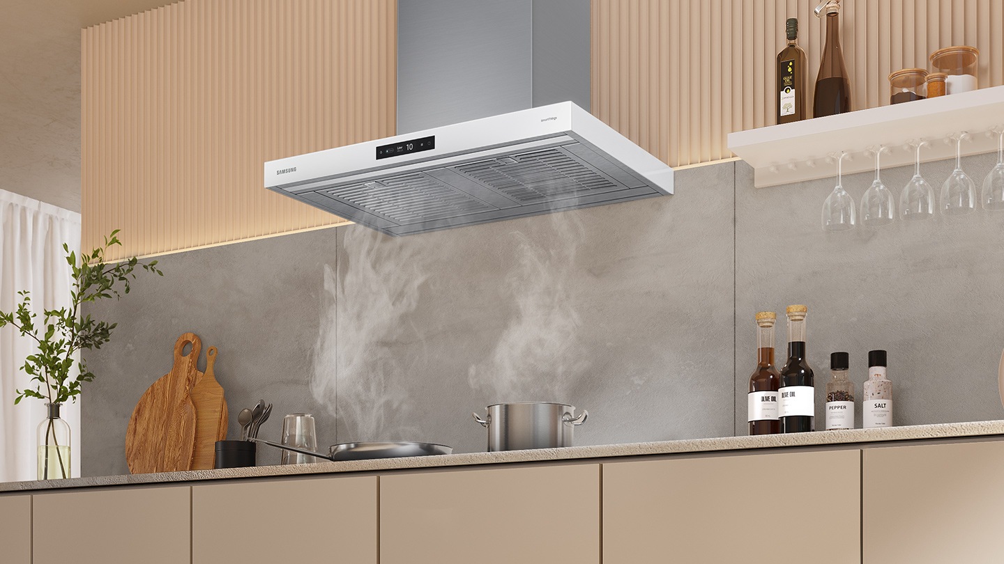 Pots and pans are boiling on the cooktop with steam, and the smoke is completely absorbed through the Power Ventilation System of NK8000.