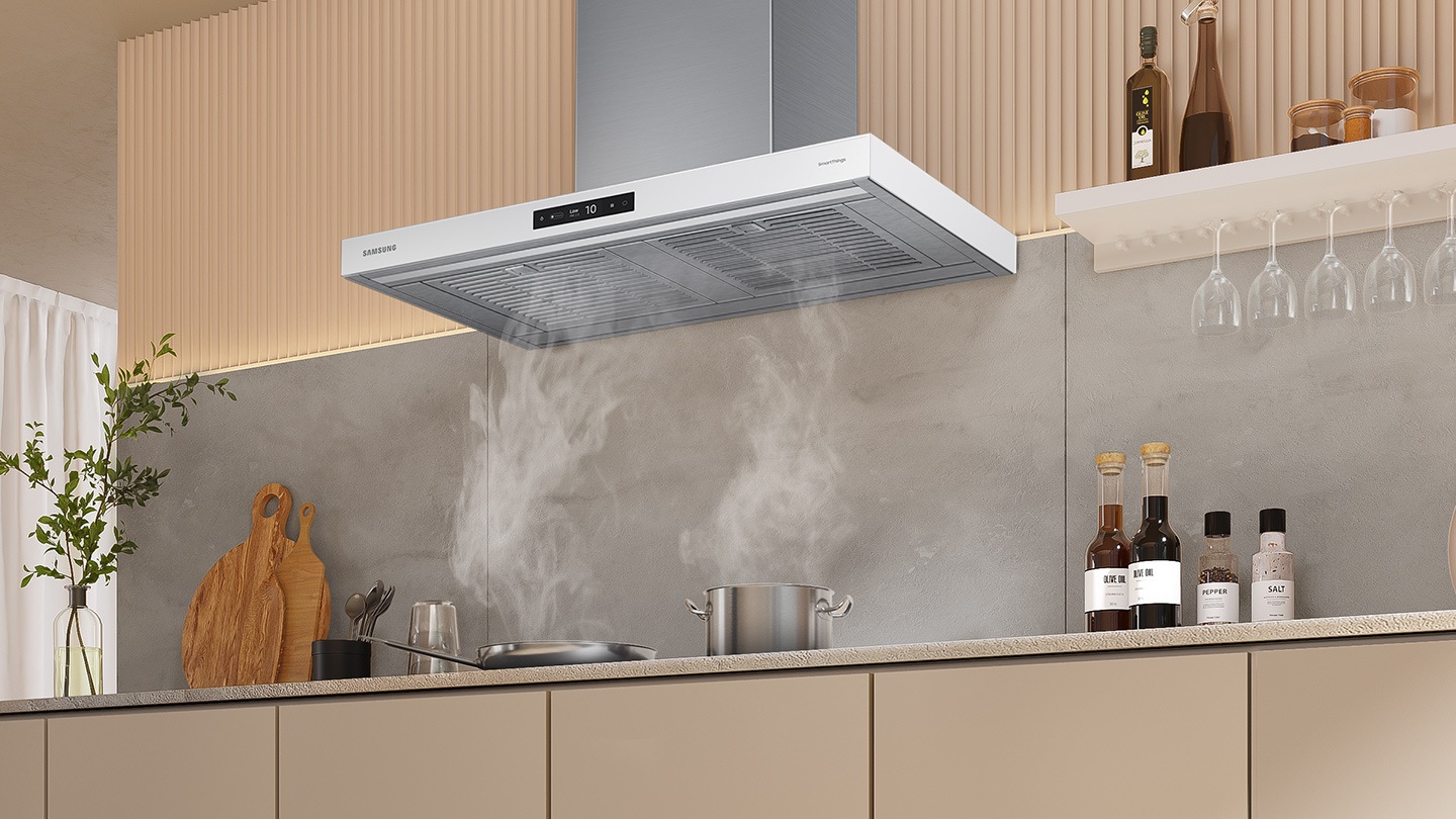 Pots and pans are boiling on the cooktop with steam, and the smoke is completely absorbed through the Power Ventilation System of NK8000.