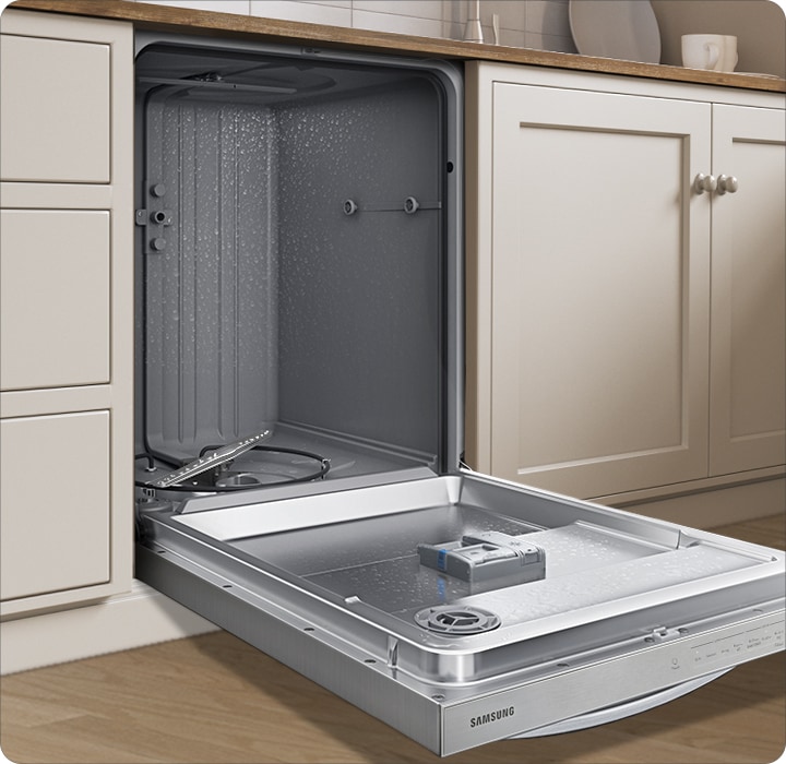 Shows the dishwasher fitted in a kitchen, with the door open to show the Hybrid Tub inside.