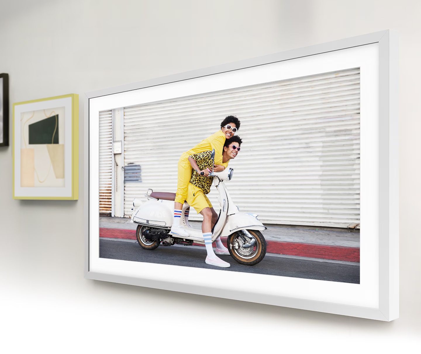 The Frame is hanging on the wall along with other picture frames, which makes The Frame look like a photo on the wall.