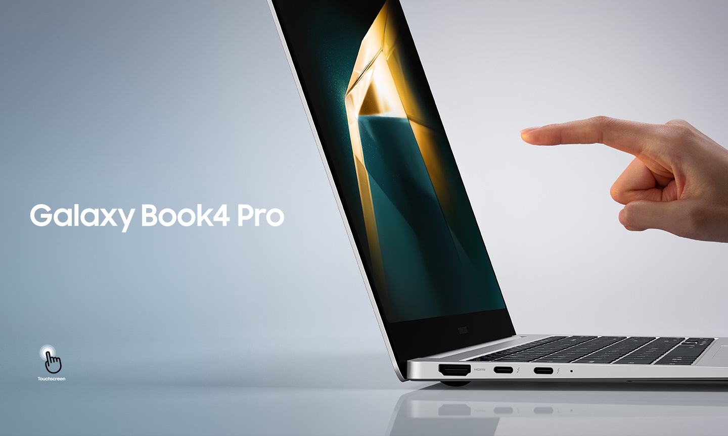 Galaxy Book4 Pro in Platinum Silver is open, facing right with a dark green and yellow wallpaper onscreen and a person's hand about to touch the screen with an index finger. Touchscreen icon shown.