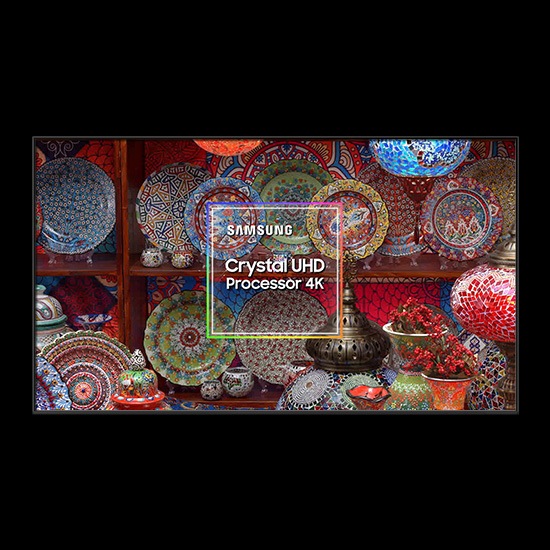 The Samsung Crystal UHD Processor 4K chip is on display in the middle amidst many colorful plates and ornaments.