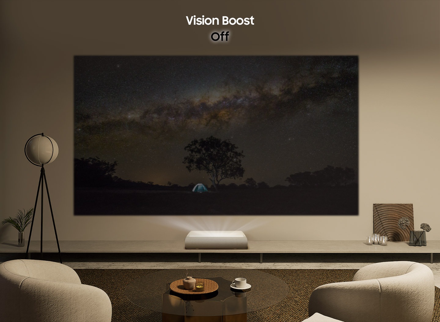 The Premiere projects a rugged mountain landscape onto the wall of a sunny living room with a brightly lit lamp. With Vision Boost Off, the image is flooded by the surrounding light and comes out faintly. With Vision Boost On, the image clears up and becomes more vivid.
