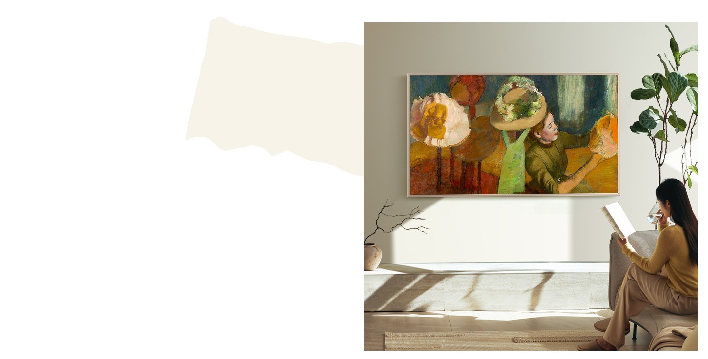 A person is sitting in a bright living room with The Frame TV hanging on the wall. As the daylight disappears and the room turns dark, the brightness of The Frame automatically decreases to adjust to the new ambient light levels. Then the person leaves the room and The Frame automatically turns itself off.