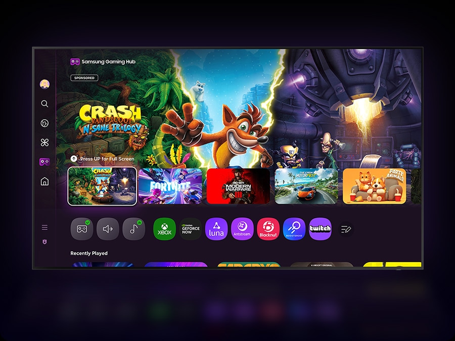 A TV displays the Samsung Gaming Hub home screen, which has options for streaming and playing games.