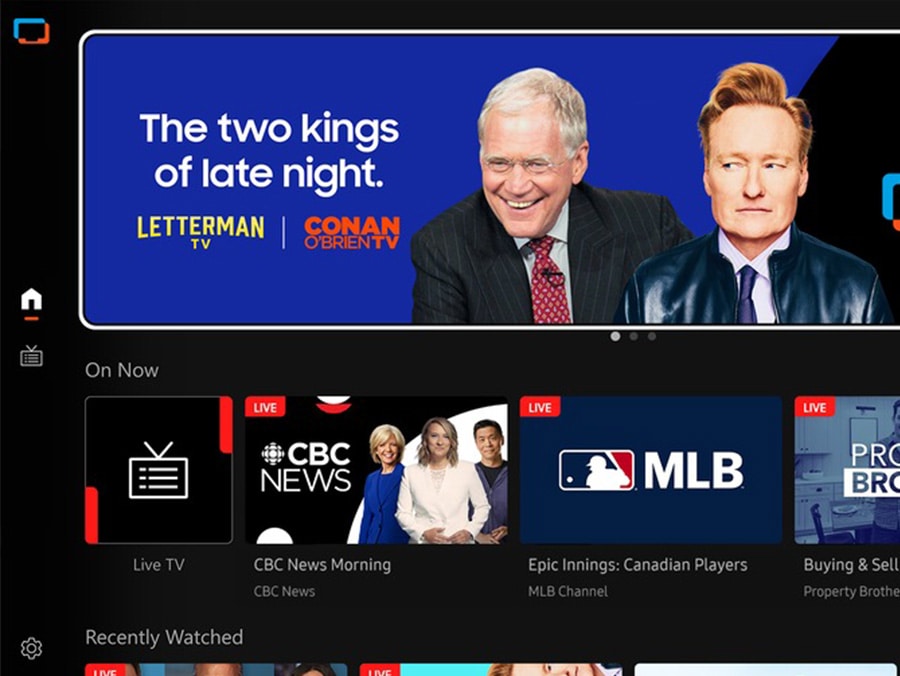 TV in a living room shows Samsung TV Plus home screen and the diverse TV channels available with it.