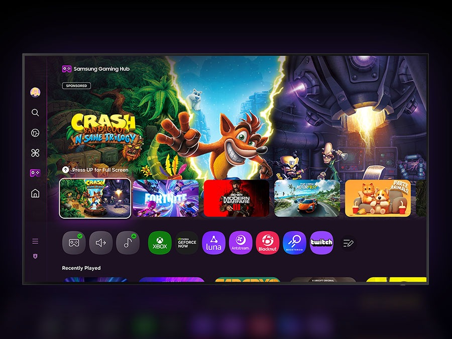 A TV displays the Samsung Gaming Hub home screen, which has options for streaming and playing games.