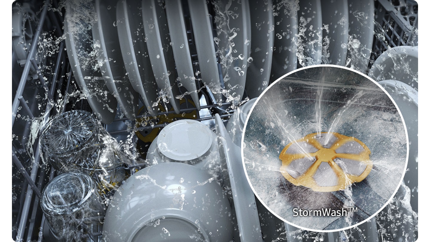 Shows the inside of the dishwasher, which is full of plates and dishes that are being washed. A close-up shows the StormWash™ system’s circle-shaped spray jet and washing arm spraying water in multiple directions inside the dishwasher.