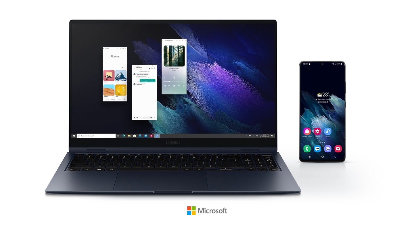 Drie Android -applicaties worden uitgevoerd op de Galaxy Book Pro 360 met behulp van uw telefoontoepassing. Een mobiele telefoon wordt direct naast de laptop geplaatst en toont een scherm met 7 applicatie -pictogrammen, wat betekent dat applicaties op de laptop kunnen worden gebruikt zonder een mobiele telefoon te gebruiken. Microsoft -logo onderaan geplaatst