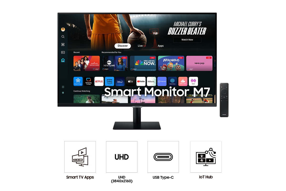 Vorderseite des 32-inch Samsung Smart Monitor M70D. Der Bildschirm zeigt Smart TV-Apps eine Fernbedienung und vier Symbole für die Funktionen von Smart TV-Apps, UHD, USB Type-C und IoT-Hub.