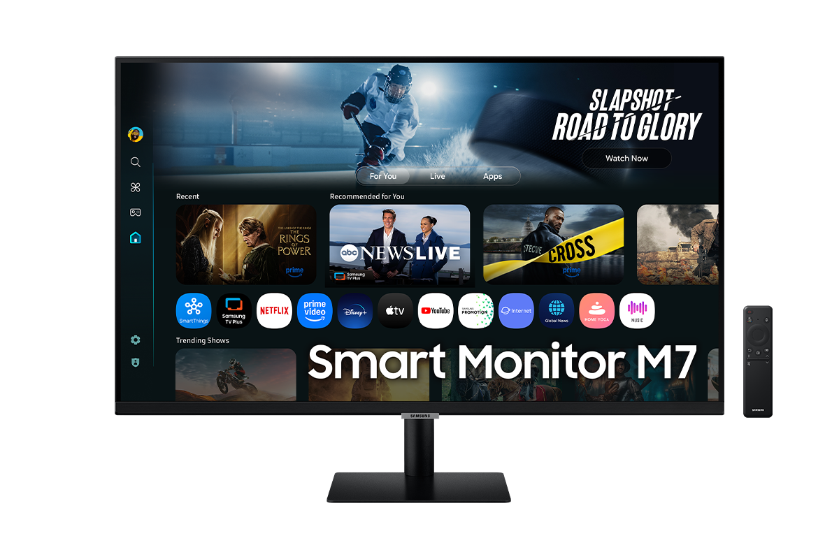 Front of 32 inch Samsung Smart Monitor M7 with the screen showing Smart TV Apps page with various content and apps lined up, and a remote control.