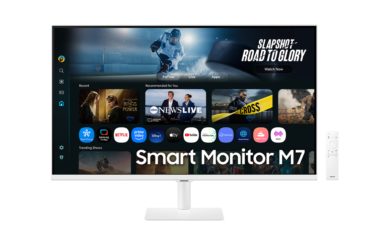 Front of 32 inch Samsung Smart Monitor M7 with the screen showing Smart TV Apps page with various content and apps lined up, and a remote control.