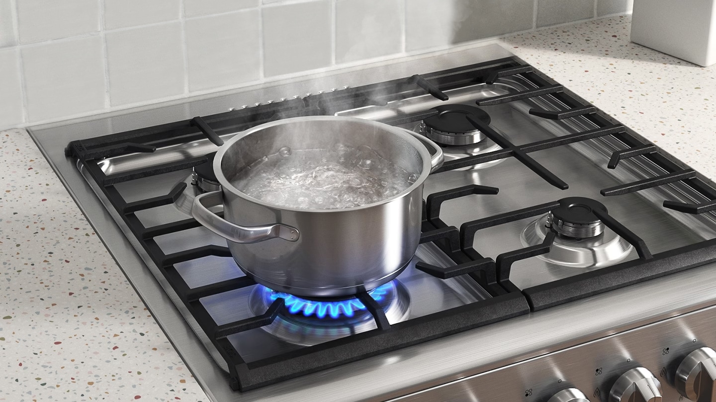 Shows a pan of water on the cooktop, which is being boiled on the Rapido Burner.
