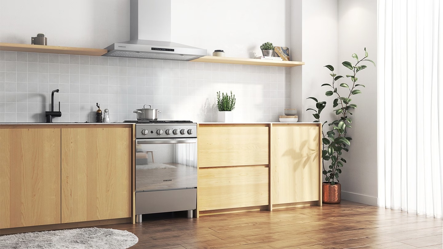 Shows a modern kitchen with the oven fitted harmoniously between the cabinets.