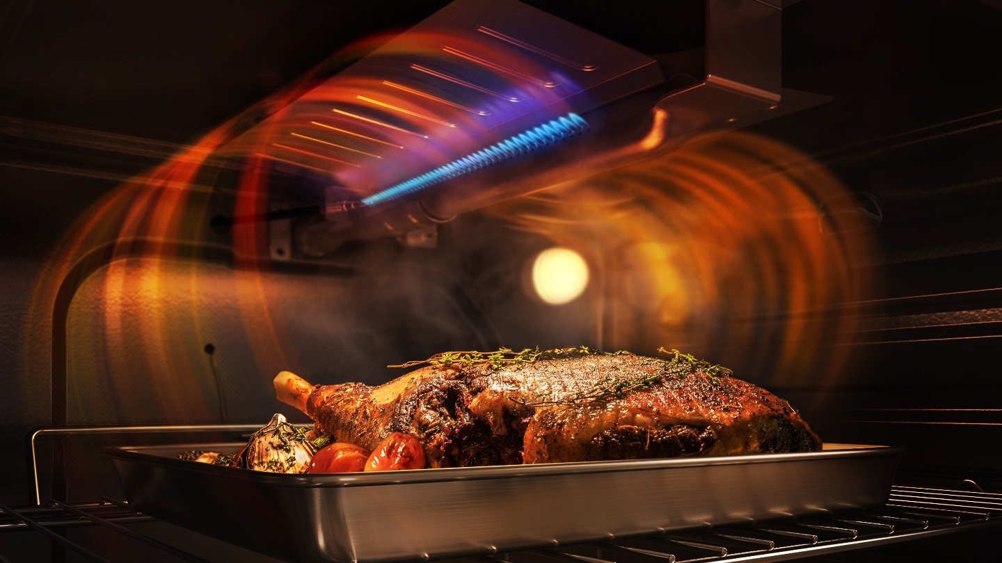 Shows a chicken inside the oven, which is being cooked using the Gas Broil Burner.