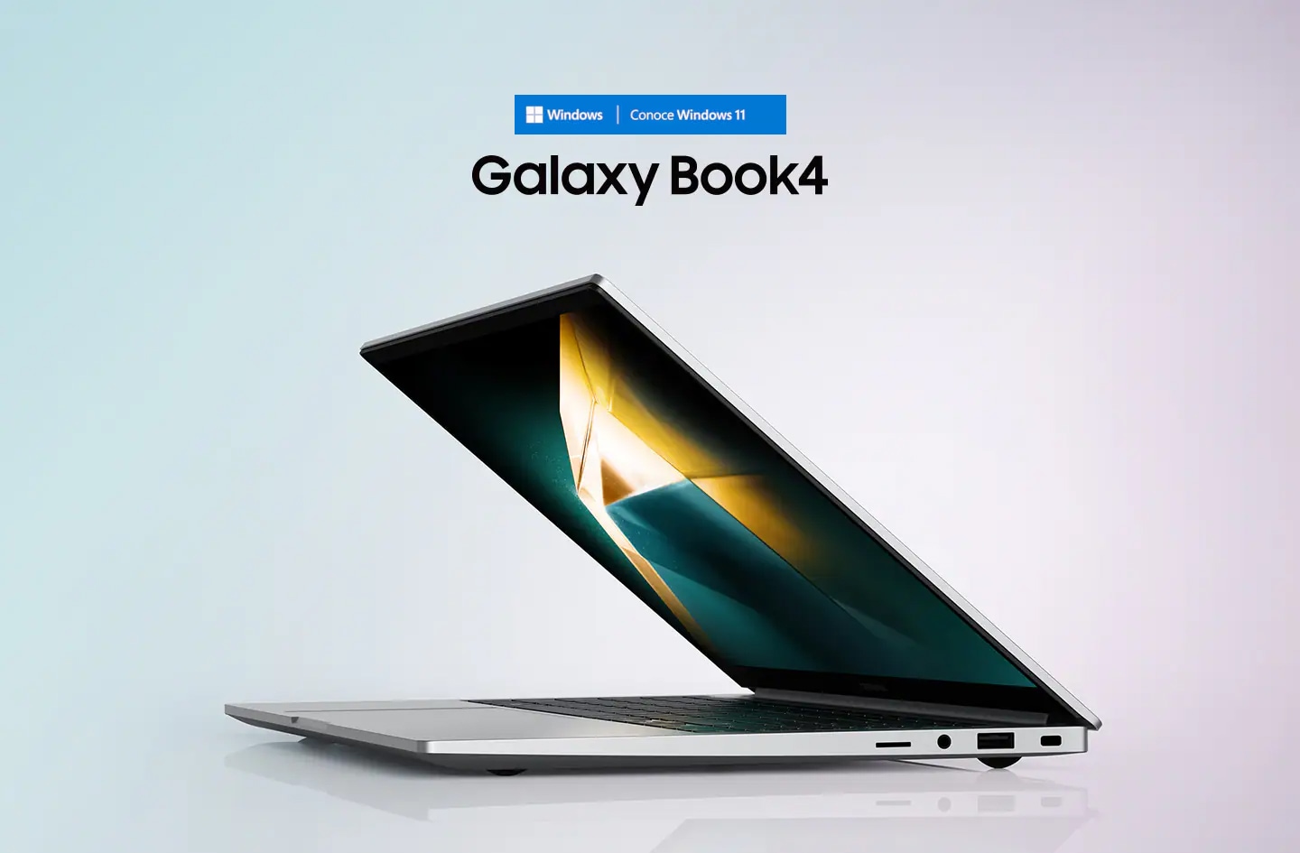 La Galaxy Book4 Silver está medio abierta, mirando hacia la izquierda con un fondo de pantalla verde oscuro y amarillo.