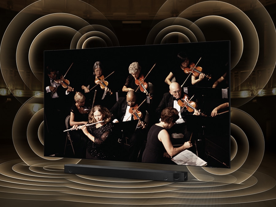 TV QLED ở phía trên Soundbar. Q-symphony được bật và đồ họa sóng âm thanh mô phỏng từ TV và Soundbar thể hiện công nghệ Q Symphony khi chúng phát âm thanh cùng nhau.