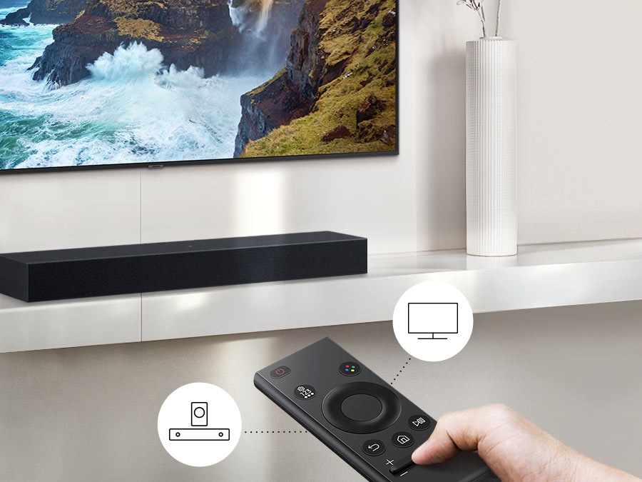 The user controls both Soundbar and TV functions with Samsung TV remote.