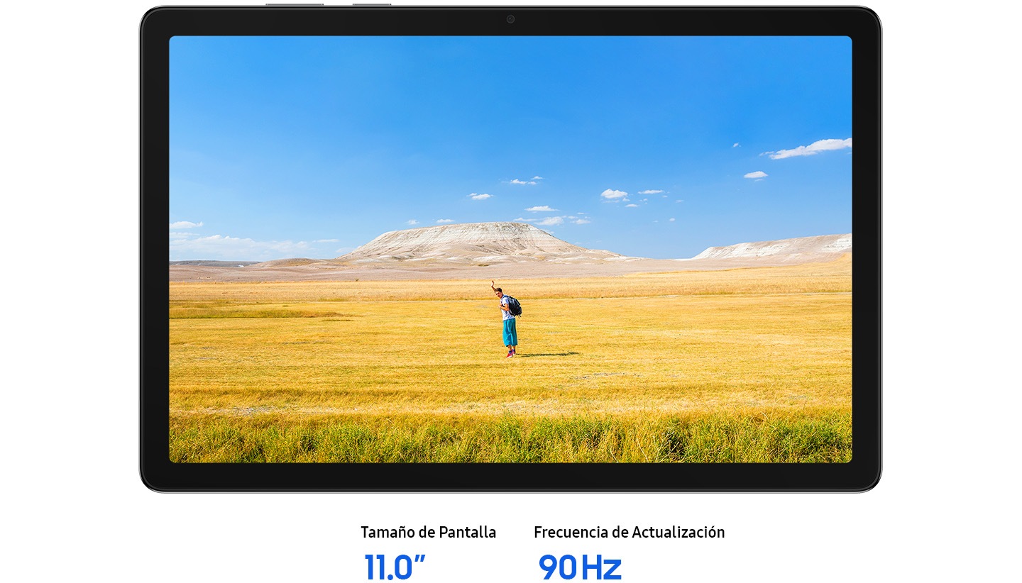 La Galaxy Tab A11+ se muestra en posición horizontal, con una imagen nítida de un hombre saludando con la mano, lo que sugiere un espíritu libre. De fondo, un cielo azul se extiende sobre un amplio horizonte de hierba amarilla y marrón. El texto indica: Tamaño de pantalla: 11,0 pulgadas, Frecuencia de actualización: 90 Hz.