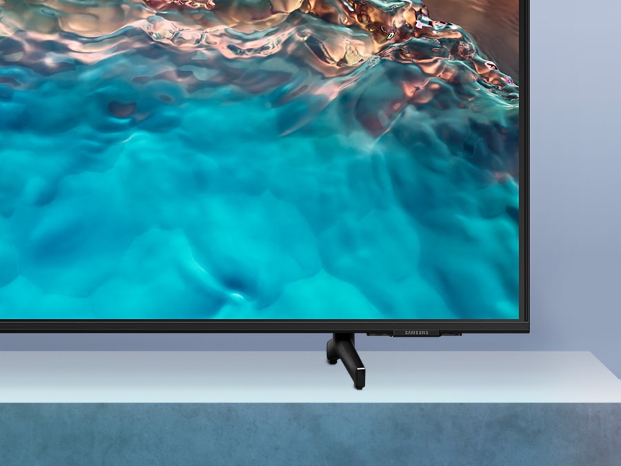 A Crystal UHD TV is placed on a height adjustable stand.
