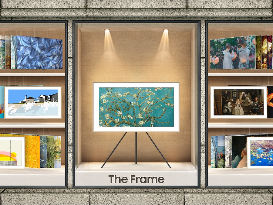 The Frame showing the artboard is displayed on a stand in the center. To its left and right, various art options found in the Art Store are displayed.