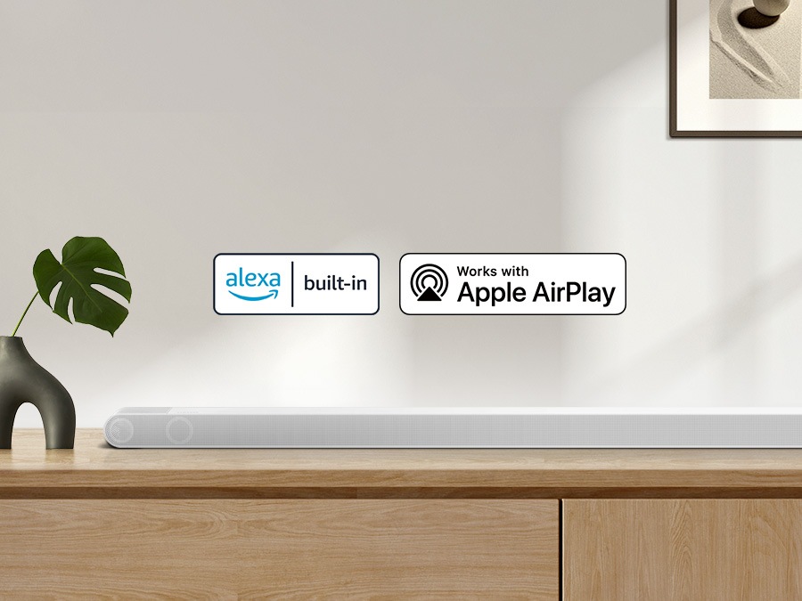 Alexa logo and Apple AirPlay logo can be seen along with Samsung S801B soundbar which is sitting on living room cabinet.