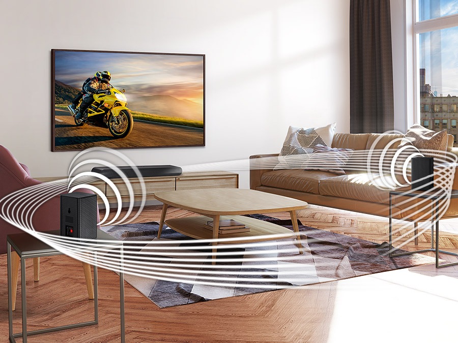 Soundwave graphics are playing from Samsung Wireless Rear Speaker Kit and Soundbar, demonstrating its Wireless Surround Sound Compatible feature.
