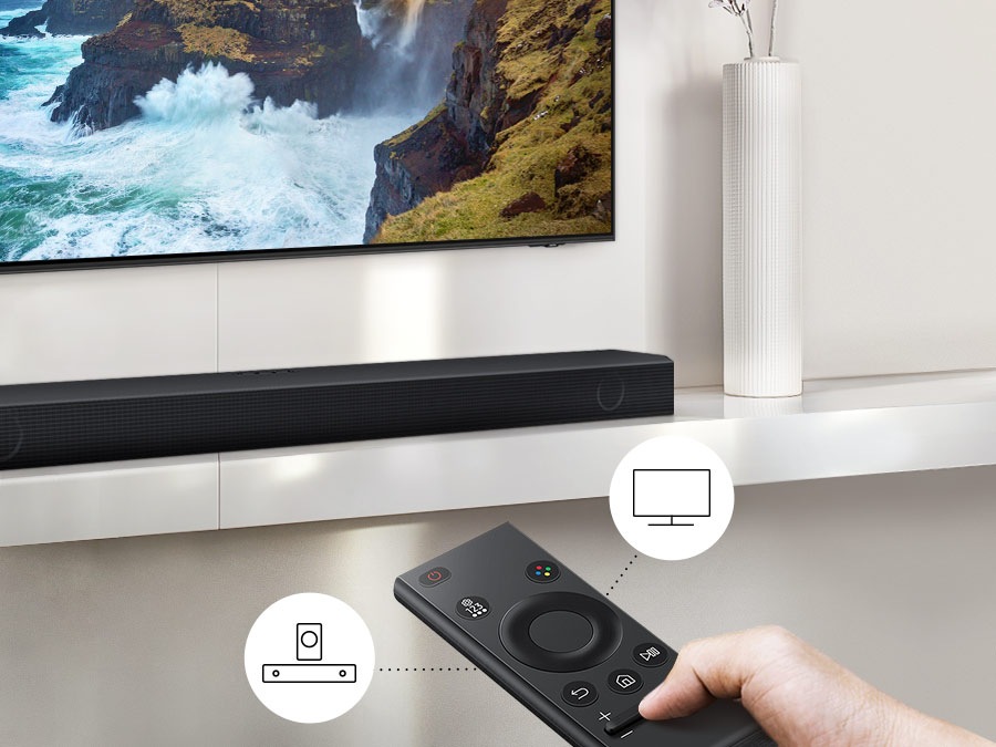 The user controls both Soundbar and TV functions with Samsung TV remote.